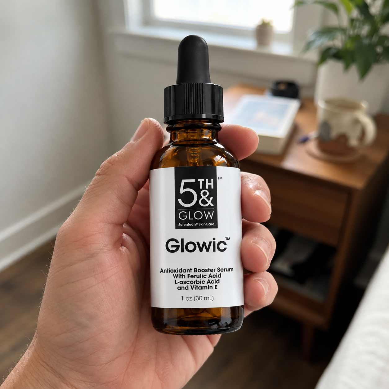 Glowic serum amber bottle held in hand